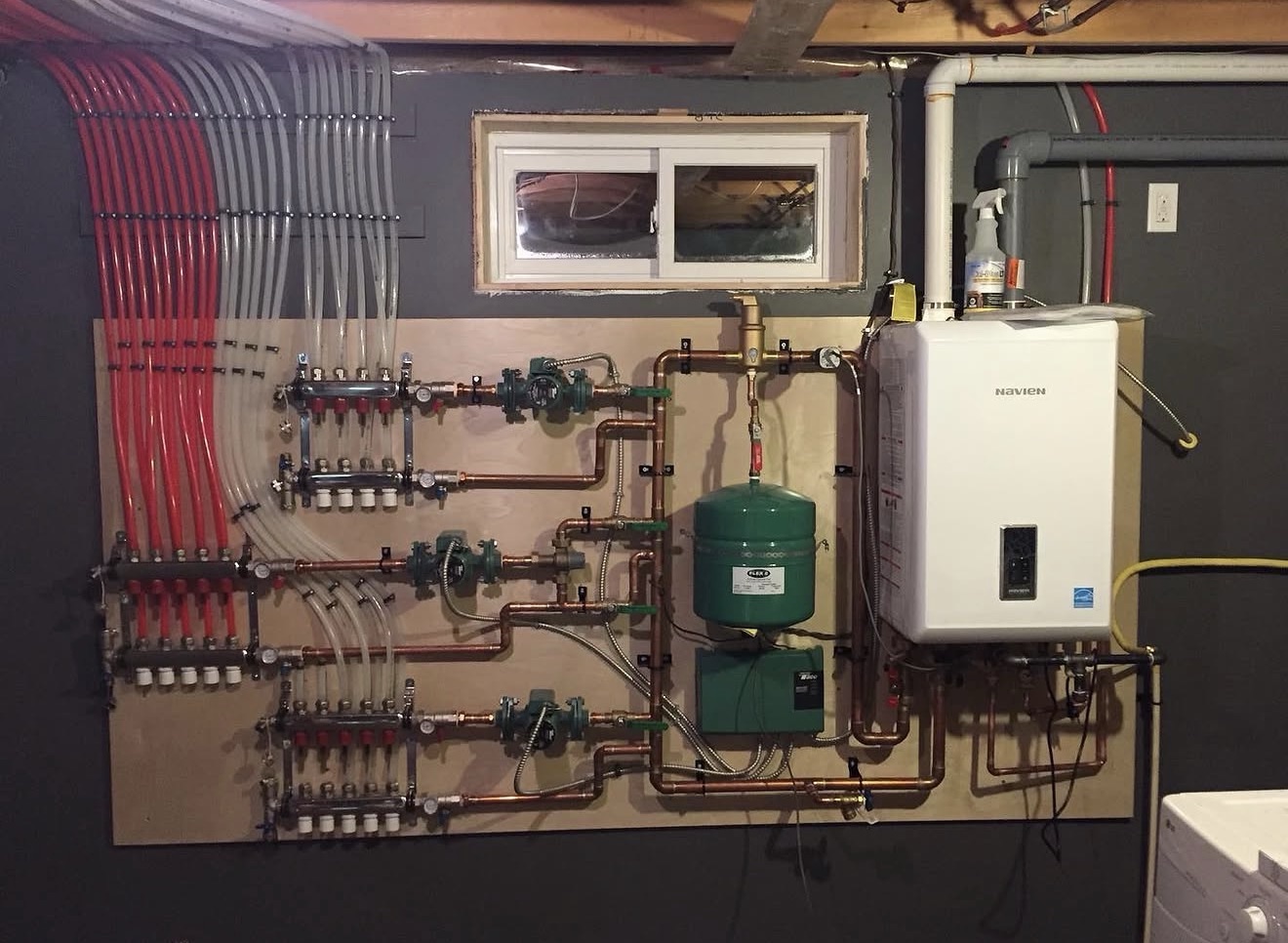 Wide boiler installation with manifolds and copper piping